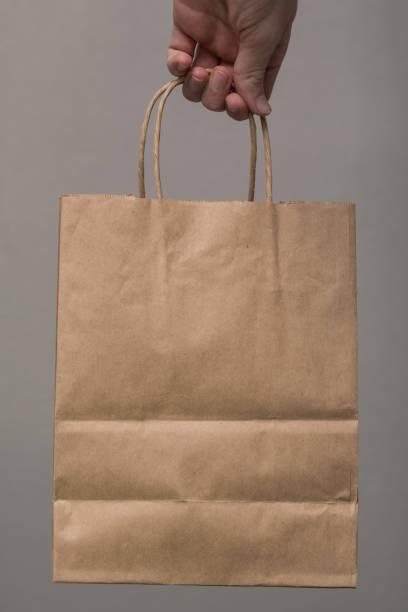 istock Brown Paper Bag Carry Hand 884198438