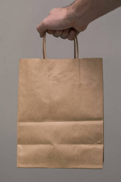 istock Brown Paper Bag Carry Hand 884203010