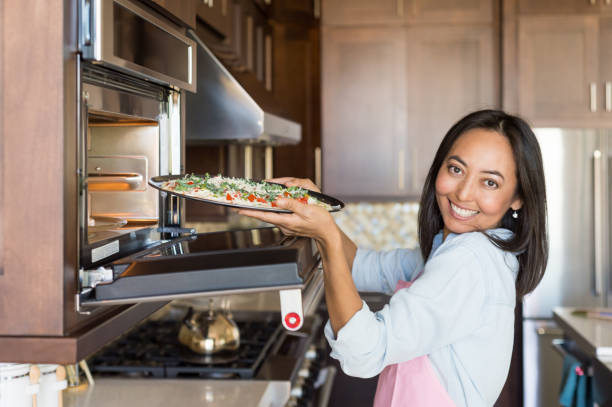 istock Eurasian Women Preparing A Healthy Pizza 884203112