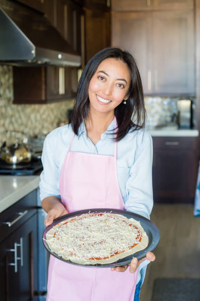 istock Eurasian Women Preparing A Healthy Pizza 884203276