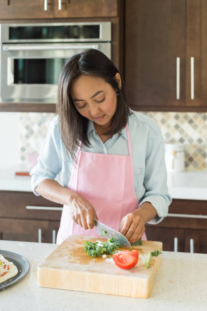 istock Eurasian Women Preparing A Healthy Pizza 884203740