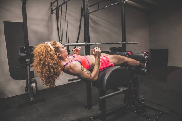 istock Red-haired girl with athletic physique during workout 884215210
