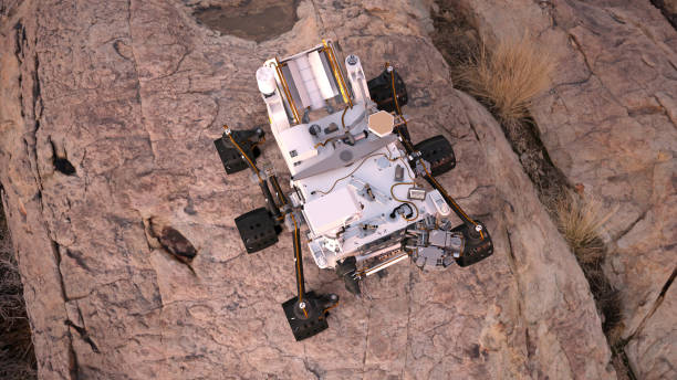 istock Mars Rover, robotic space autonomous vehicle on a deserted planet, top view, 3D illustration 884220616