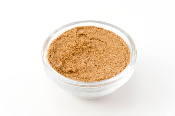 istock Coriander powder in Glass container isolated on white background 884220966