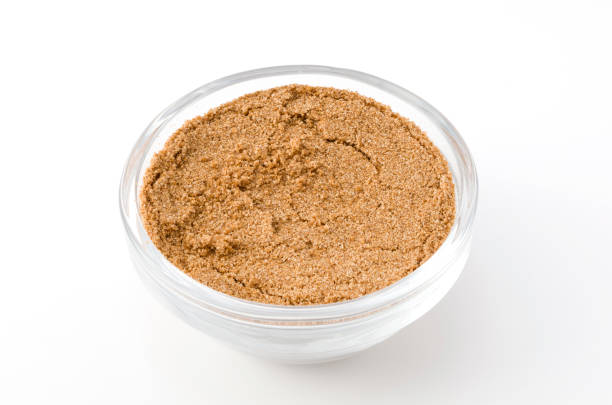 istock Coriander powder in Glass container isolated on white background 884221010