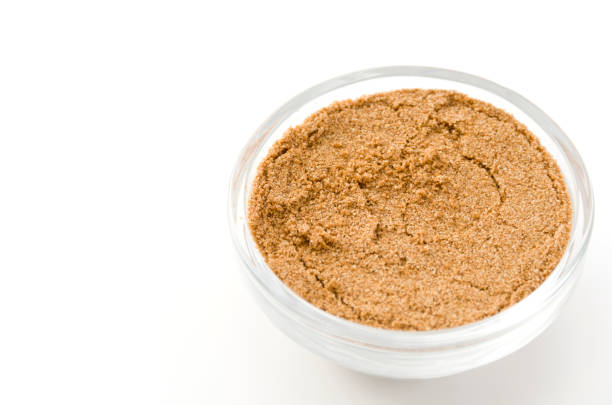 istock Coriander powder in Glass container isolated on white background 884221018
