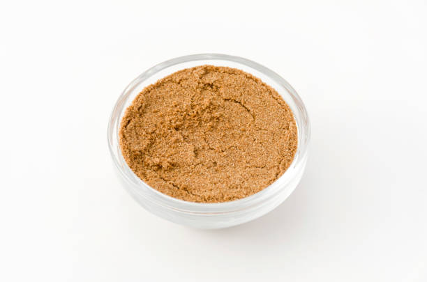 istock Coriander powder in Glass container isolated on white background 884221032
