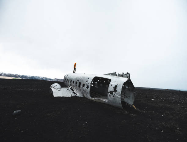 istock Man alone on the airplane wreck in iceland 884224452