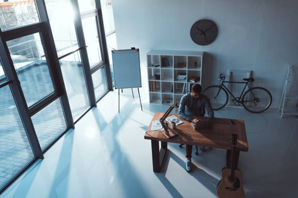 istock businessman using laptop in office 884225052