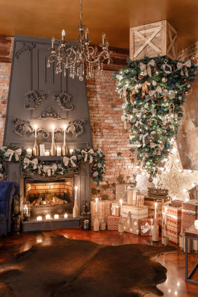 istock alternative tree upside down on the ceiling. Winter home decor. Modern loft interior with fireplace and brick wall 884228106