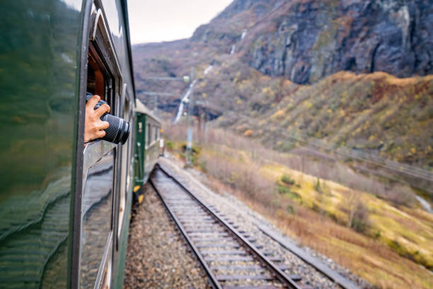istock Taking pictures of landscape from a train window 884228556