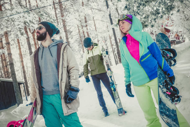 istock Snowboarders on winter journey 884276502