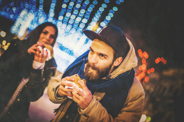 istock Couple eating on the street 884276526