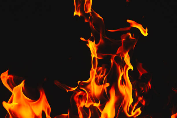 istock Red hot flames of fire isolated on black 884281848