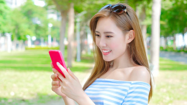 istock woman use phone 884281896