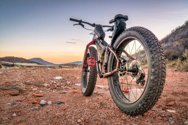 fat bike on a desert trail with deep, loose gravel fat bike on desert trail with deep, loose gravel - Big Hole Wash Trail in Red Mountain Open Space north of Fort Collins, Colorado desert wash stock pictures, royalty-free photos & images