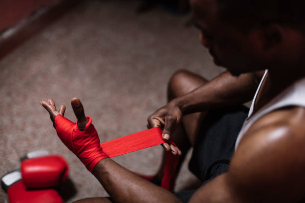 Preparation Man fixing his equipment before the match boxing sport stock pictures, royalty-free photos & images