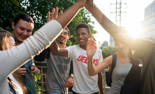 istock Friends giving high fives 884301598