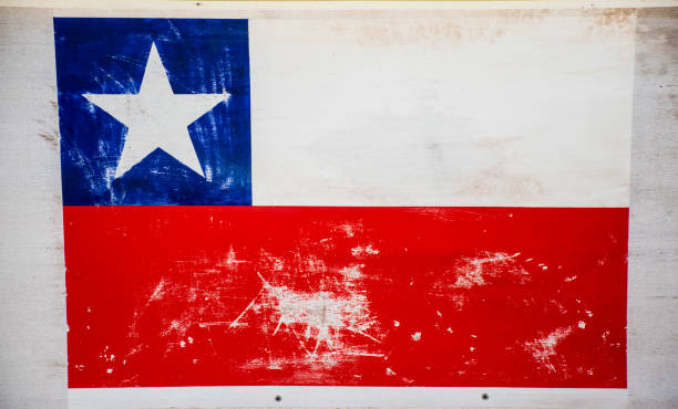 istock Worn Ecuadorian flag on a wooden signpost. 884303844