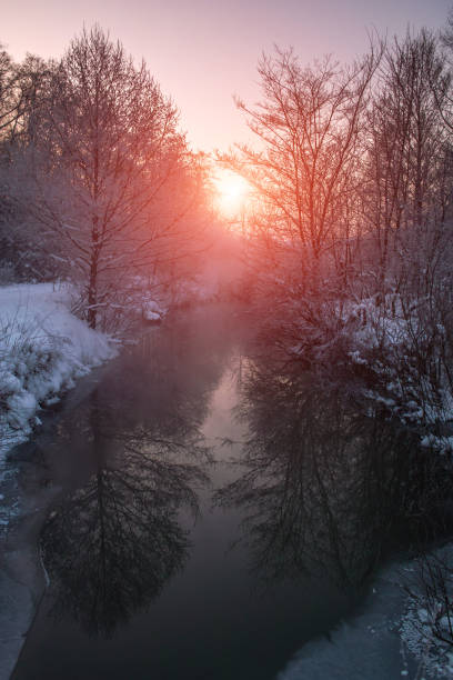 istock River on the frozen winter day 884316674