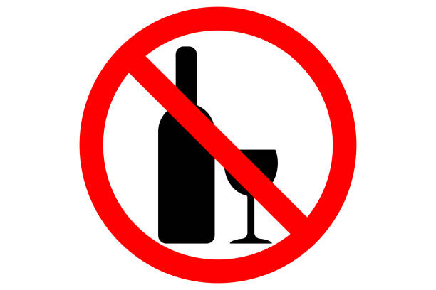 istock ALCOHOL FREE ZONE sign. Wine bottle and glass silhouettes in red circle. Vector 884331722