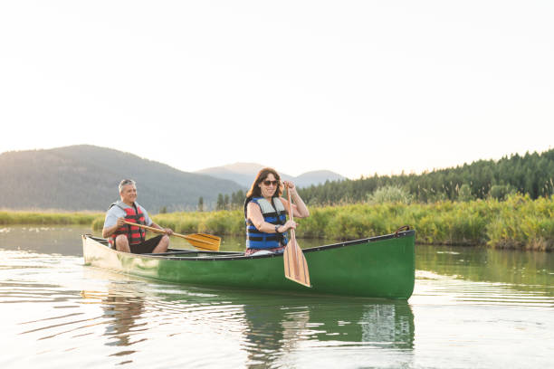 istock Canoeing Together on a Beautiful Lake 884333184