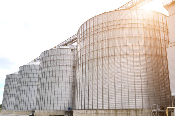 istock Agricultural Silos. Metal grain facility with silos. 884347676