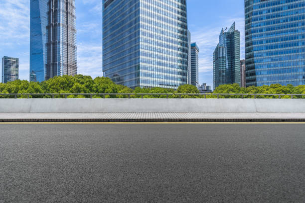 istock Clean asphalt road with shanghai city skyline background 884352914