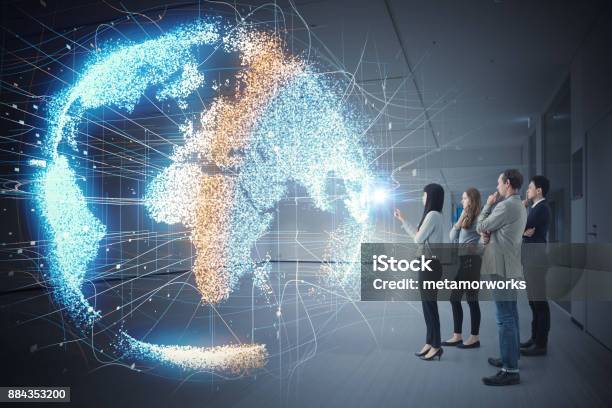 Group Of People Watching Holographic Of The Earth Astronomy Concept Stock Photo - Download Image Now