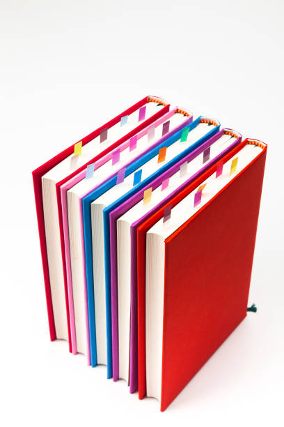 istock Stack of colorfully covered  books isolated on the a white 884355416