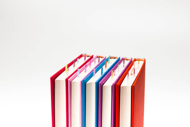 istock Stack of colorfully covered  books isolated on the a white 884355458