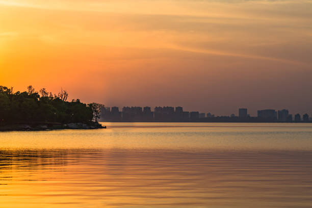 istock City Skyline By River Against Sky at twilight 884355720