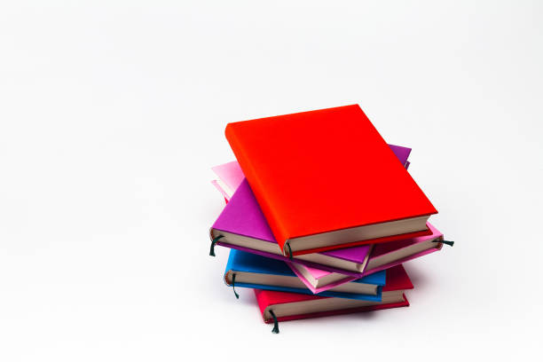 istock Stack of colorful books isolated on the white 884358598