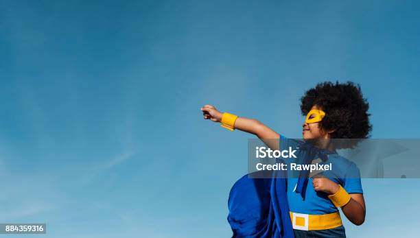 Girl With Afro Playing Superhero Stock Photo - Download Image Now - Child, Superhero, Confidence