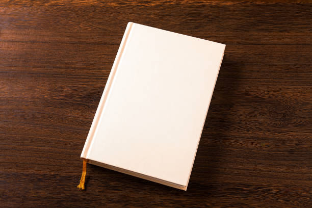 istock Hardcover Book on wood desk 884359560