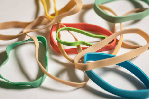 Normal And Colored Rubber Bands stock photo