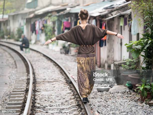 Tourist Balancing Along The Railroad Tracks Of Hanoi Vietnam Stock Photo - Download Image Now