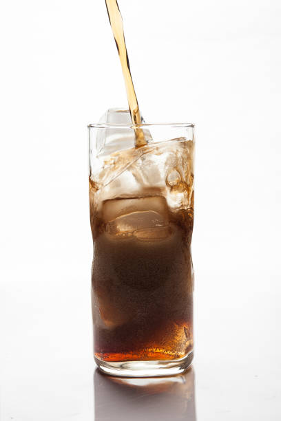 istock Cola Pouring to Glass with ice 884374462