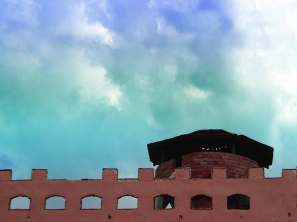 ancient brick wall fortress back on old brick wall and white cloud in the sky