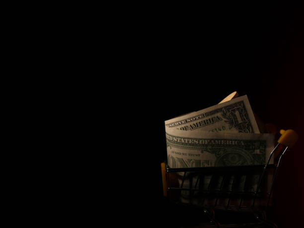 istock Dollars in the shopping trolley 884377558