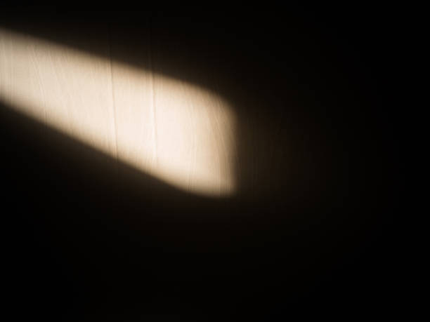 istock Shadow of a window light on the wall 884378108
