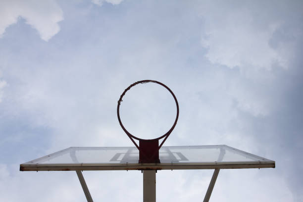 istock Basketball basket with transparent backboard on beautiful sky 884381292