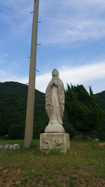 istock Virgin Mary at cemetery in south korea 884383650