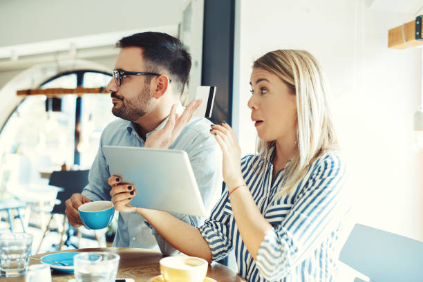 istock Couple in Cafe 884383974