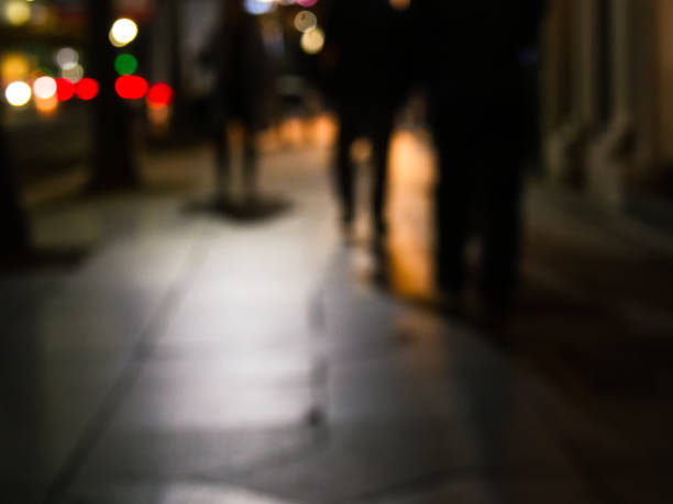 istock Defocused image of street at night 884384338