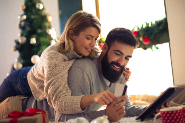 istock Beautiful couple shopping online 884387264