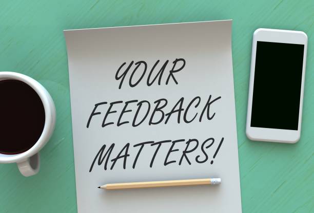 your feedback matters, message on paper, smart phone and coffee on table - business form smart phone customer imagens e fotografias de stock