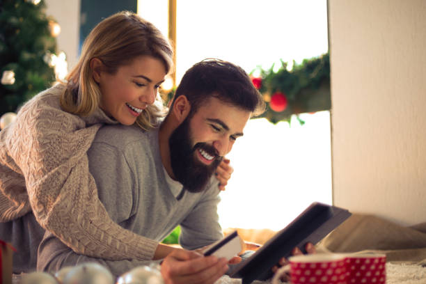 istock Beautiful couple shopping online 884391786