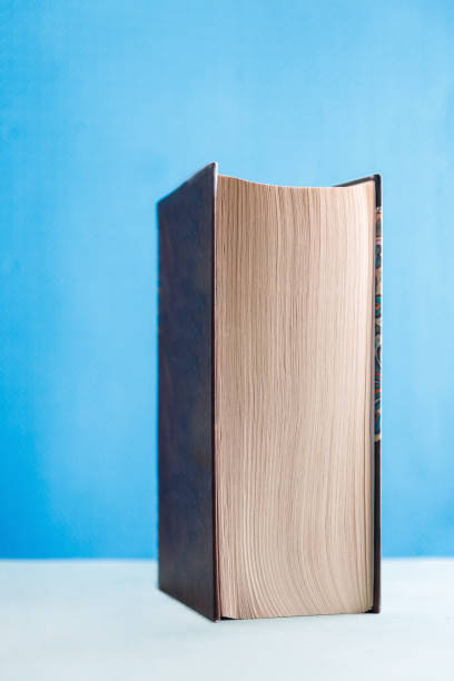 istock the book is hardcover on blue background 884413036