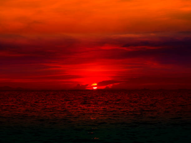 istock sunset last light of sun on horizontal sky and ocean 884422230